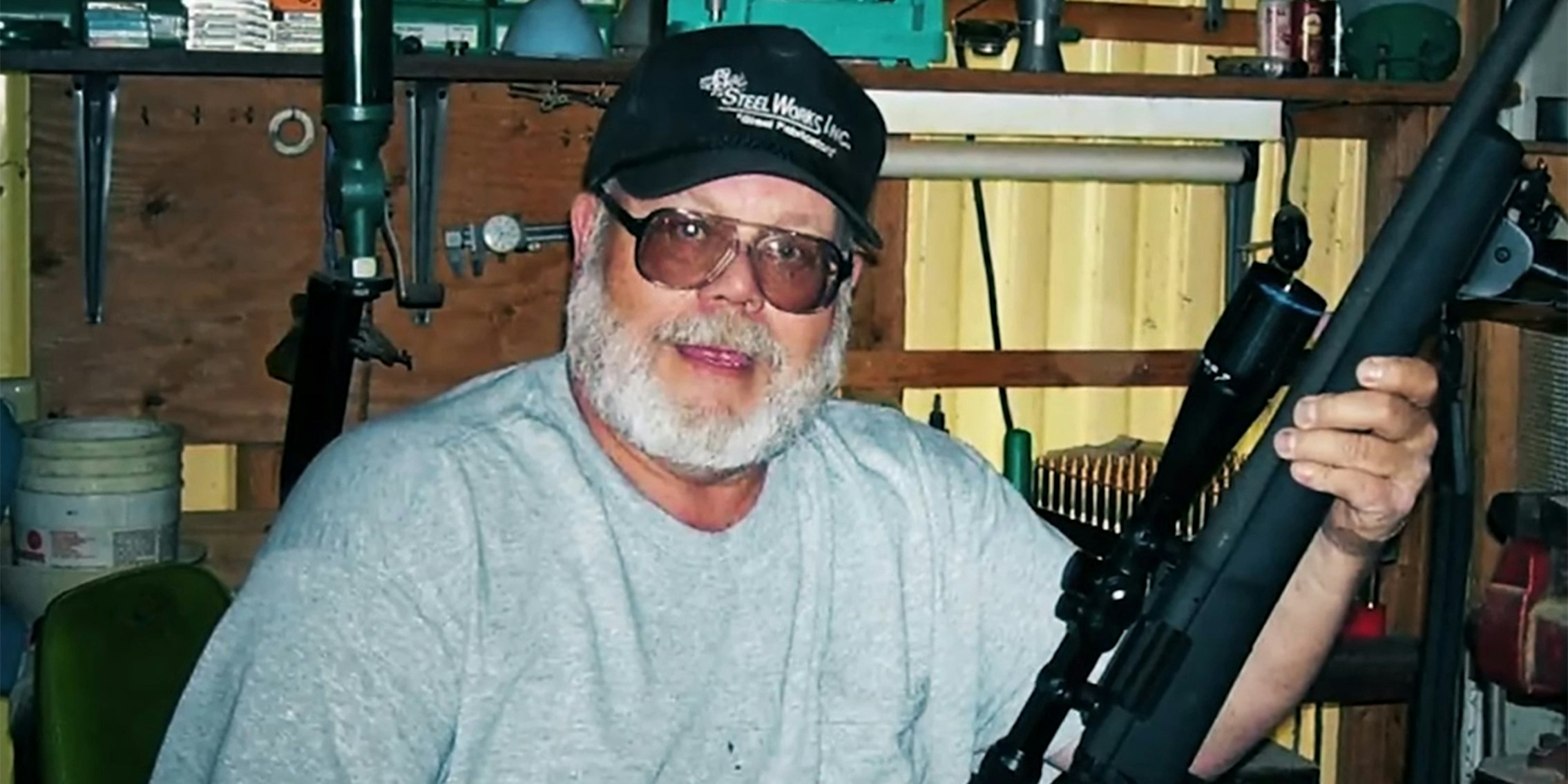 Craig Deleeuw Robertson holding rifle