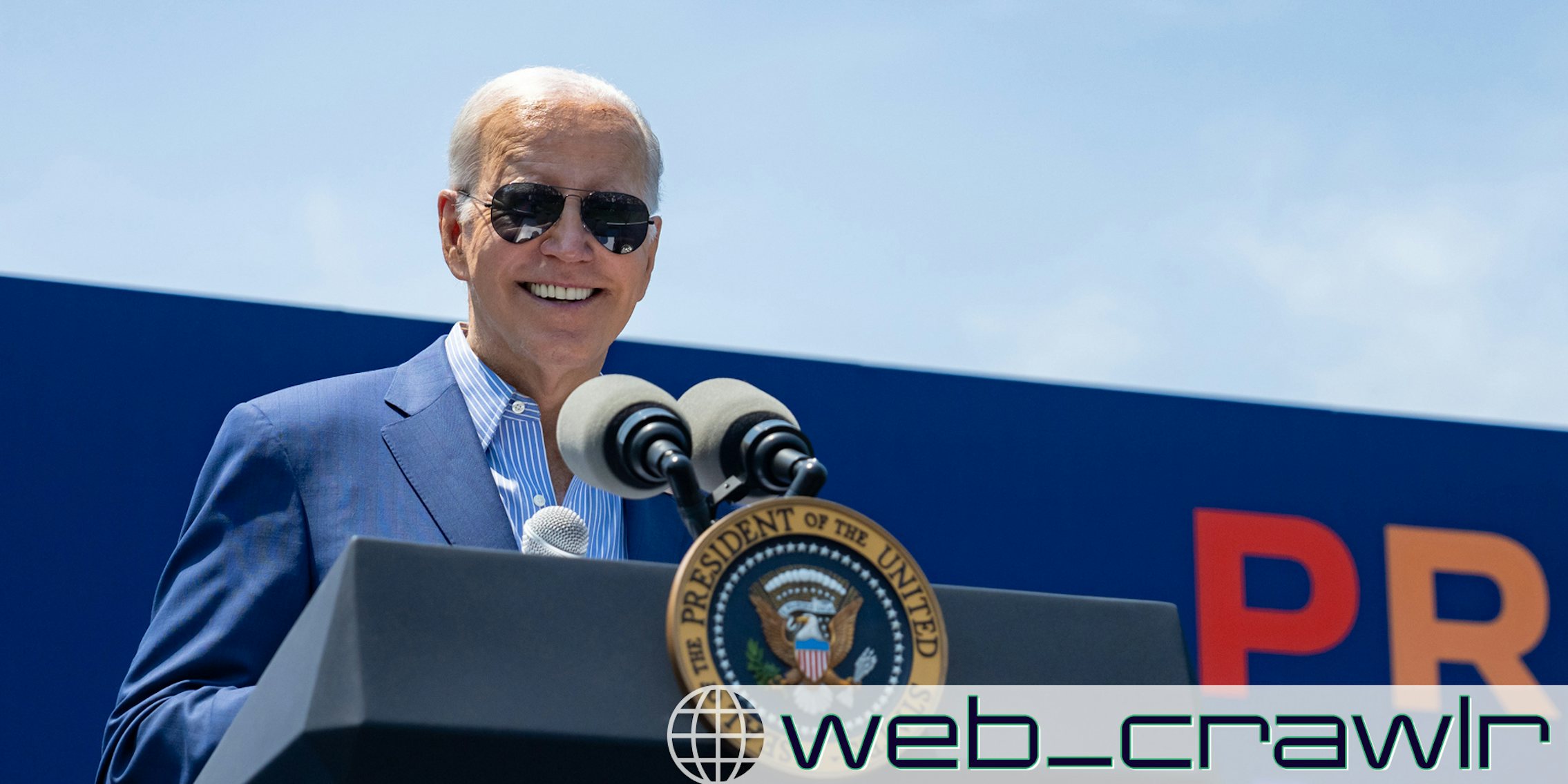 Joe Biden speaking at a podium. The Daily Dot newsletter web_crawlr logo is in the bottom right corner.