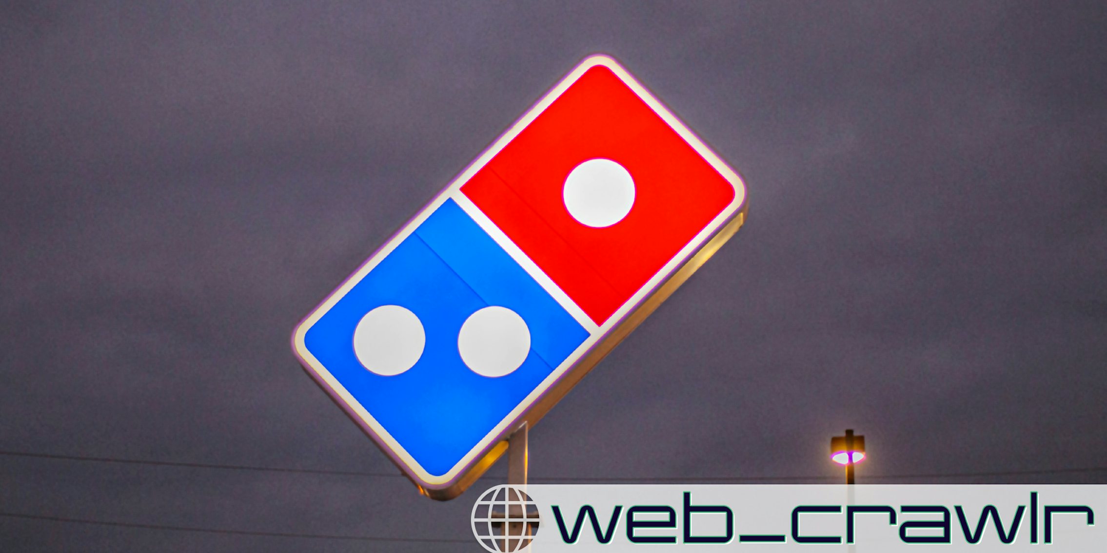 A Domino's Pizza sign. The Daily Dot newsletter web_crawlr logo is in the bottom right corner.