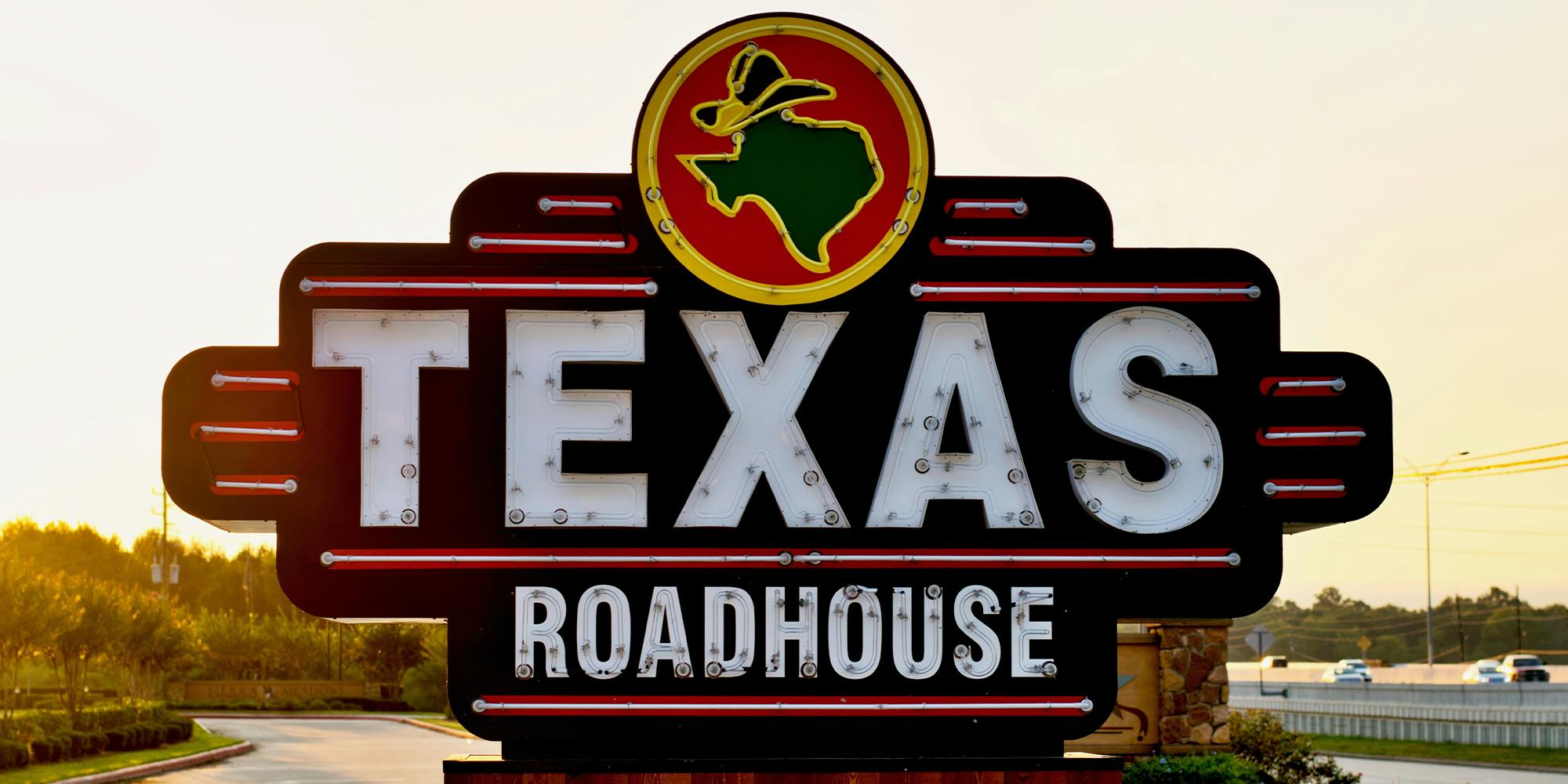Texas Roadhouse restaurant sign on a freeway in Humble, Texas.