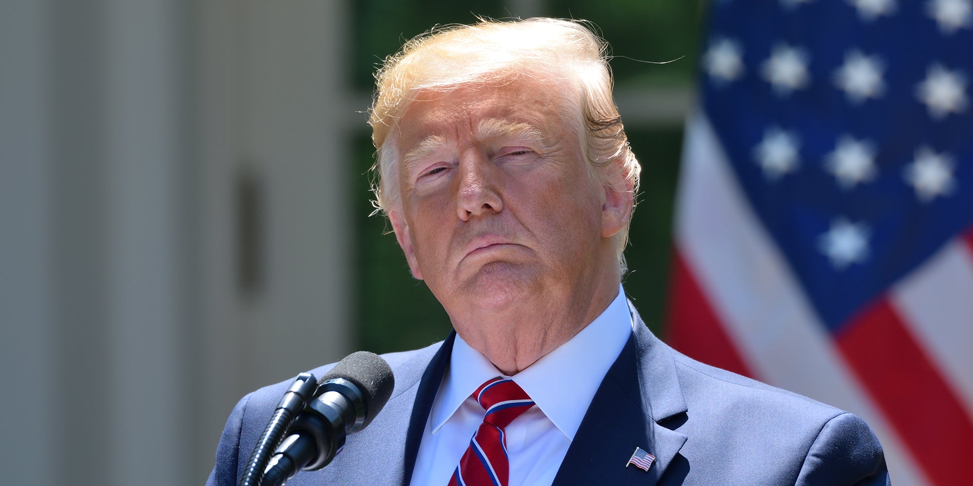 Donald Trump pauses with a serious face during a press conference