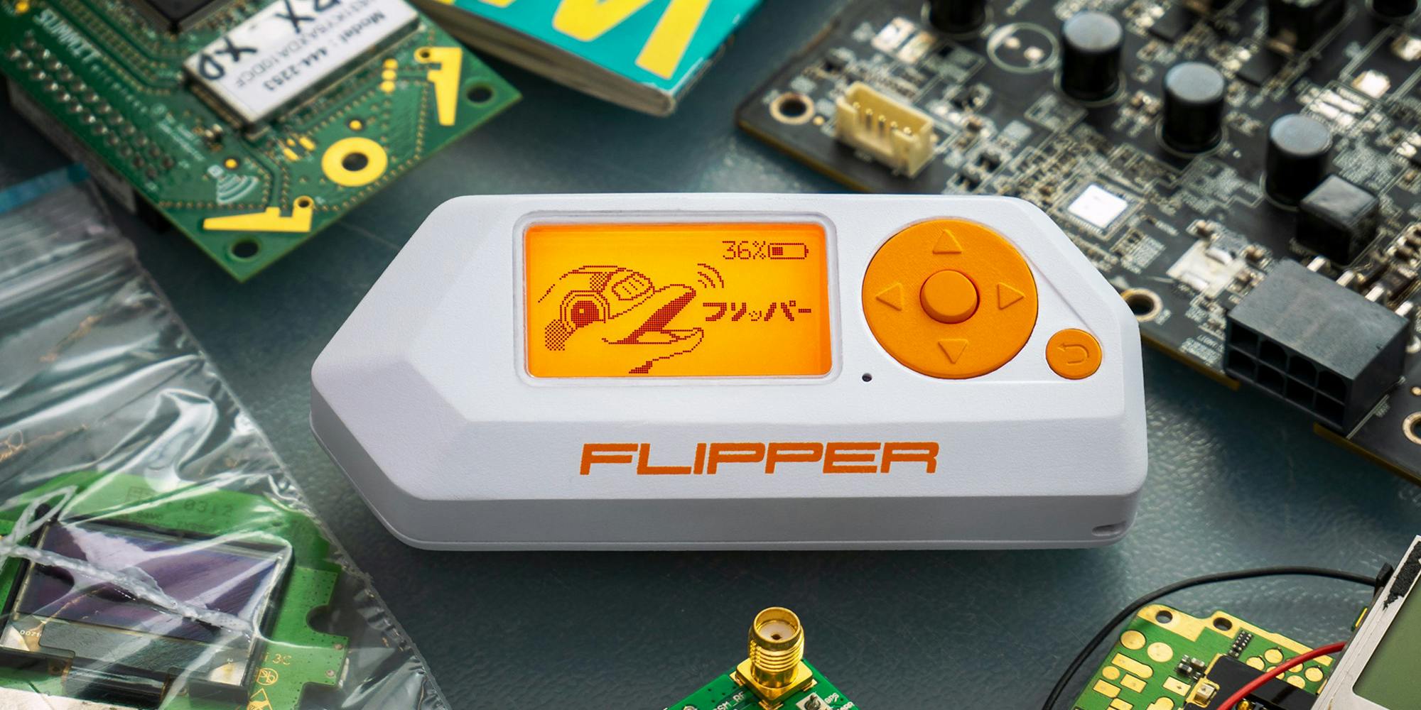 Flipper portable multi-tool device with circuits around on grey surface