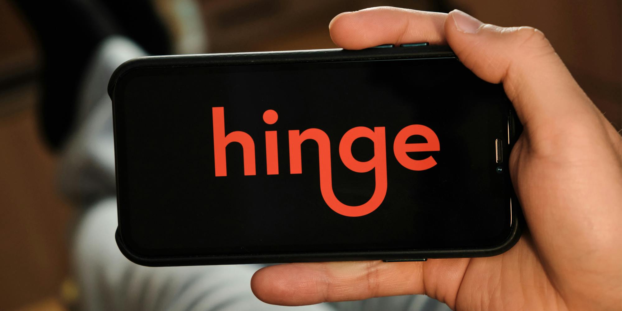 Hinge dating app on phone screen in hand