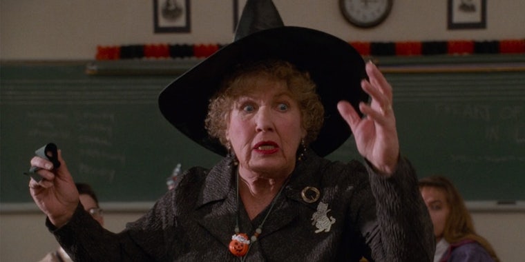 teacher wearing witch hat