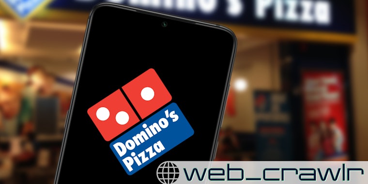 A phone with the Domino's Pizza logo. The Daily Dot newsletter web_crawlr logo is in the bottom right corner.