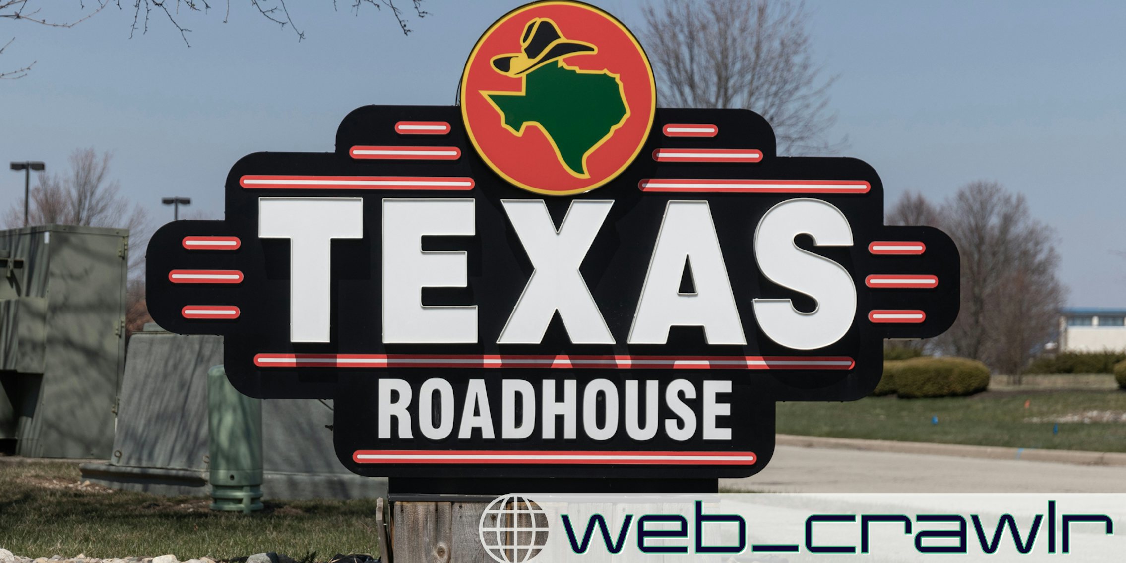 A Texas Roadhouse sign. The Daily Dot newsletter web_crawlr logo is in the bottom right corner.
