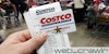 A person holding a Costco card and receipt. The Daily Dot newsletter web_crawlr logo is in the bottom right corner.