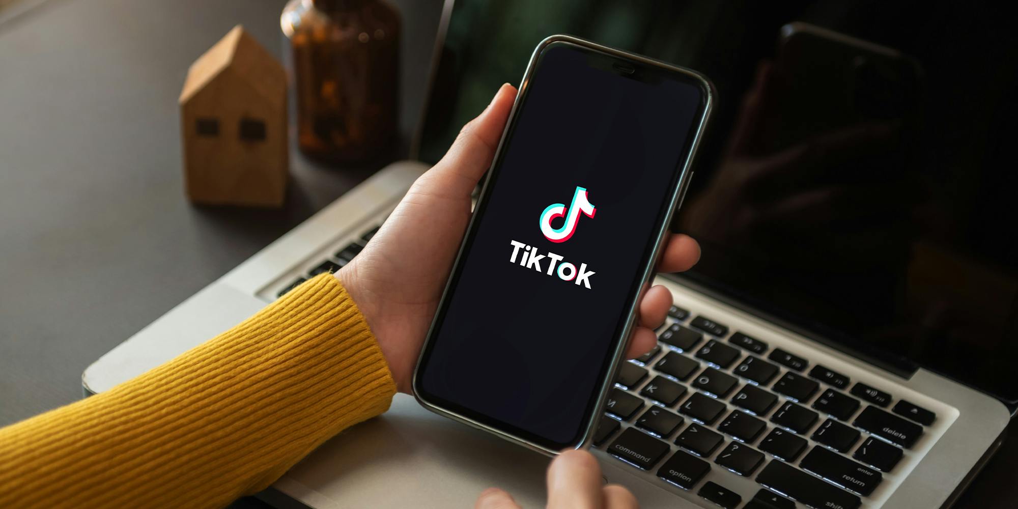 Closed up image of a Female using TikTok application on a smartphone in home.