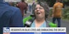 Seattle resident speaking into Fox News reporter's microphone outside