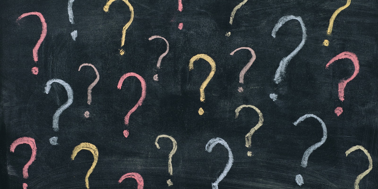 Colorful question marks on chalkboard background