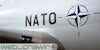 A plane with the NATO logo on it. The Daily Dot newsletter web_crawlr logo is in the bottom left corner.