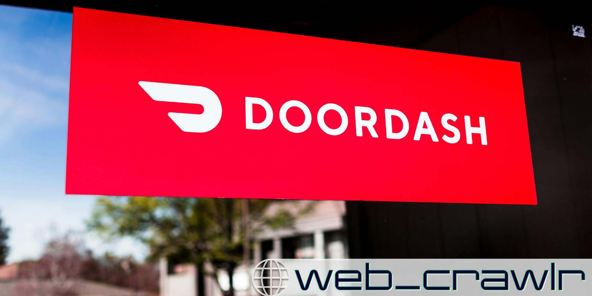 A DoorDash sign. The Daily Dot newsletter web_crawlr logo is in the bottom right corner.