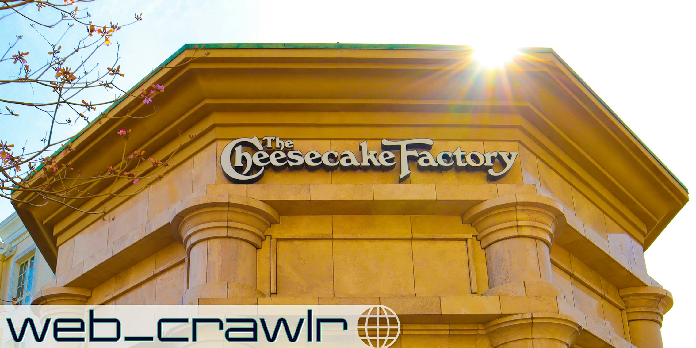 A Cheesecake Factory sign. The Daily Dot newsletter web_crawlr logo is in the bottom left corner.