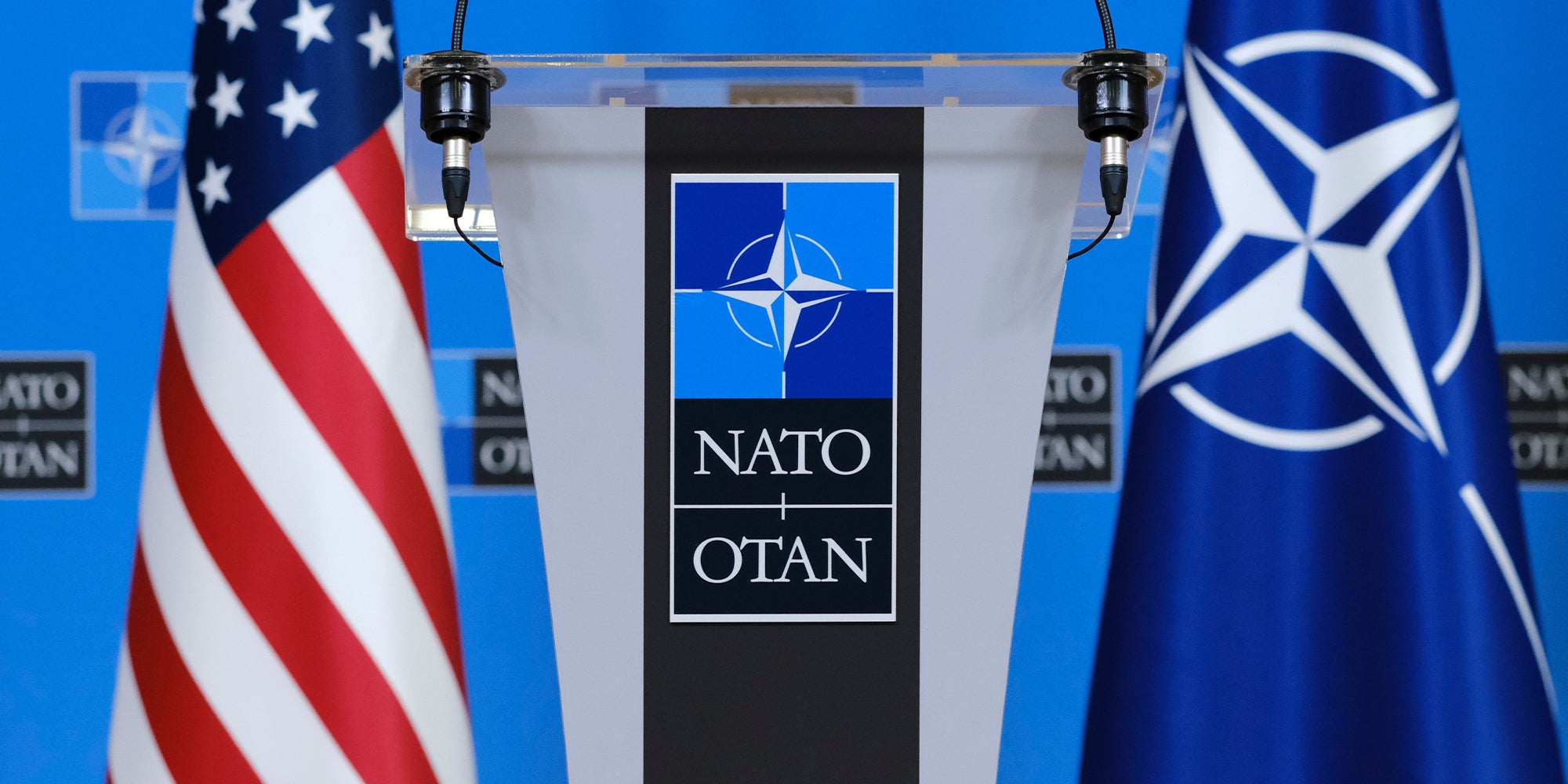 US flags stand in press room at the NATO headquarters