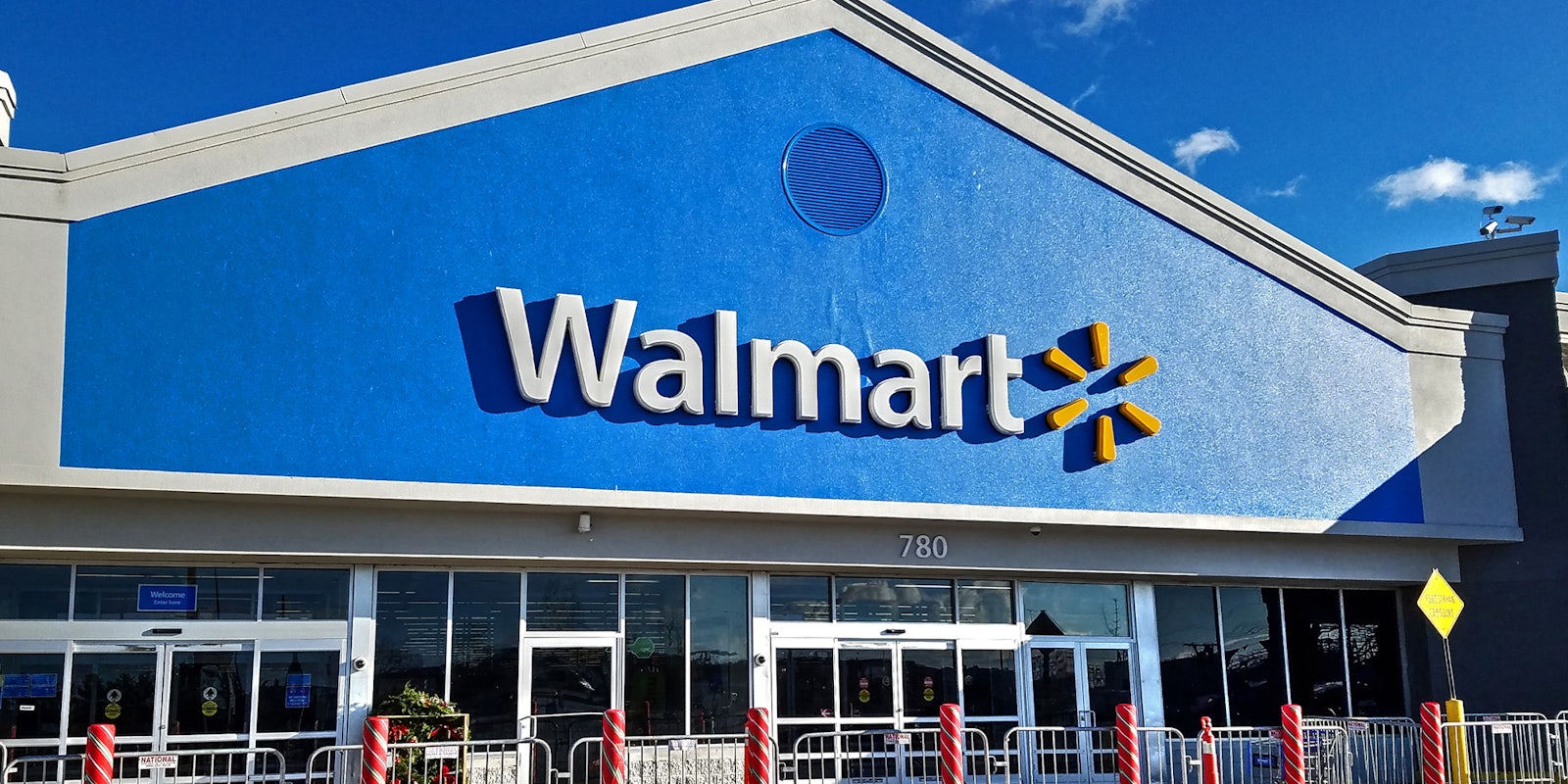 Walmart retailer storefront entrance bright sunshine day, Lynn Massachusetts USA,