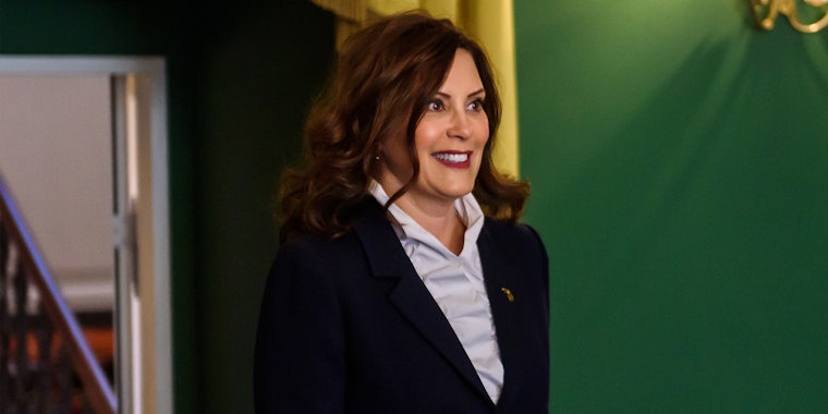 Gretchen Whitmer in front of green background