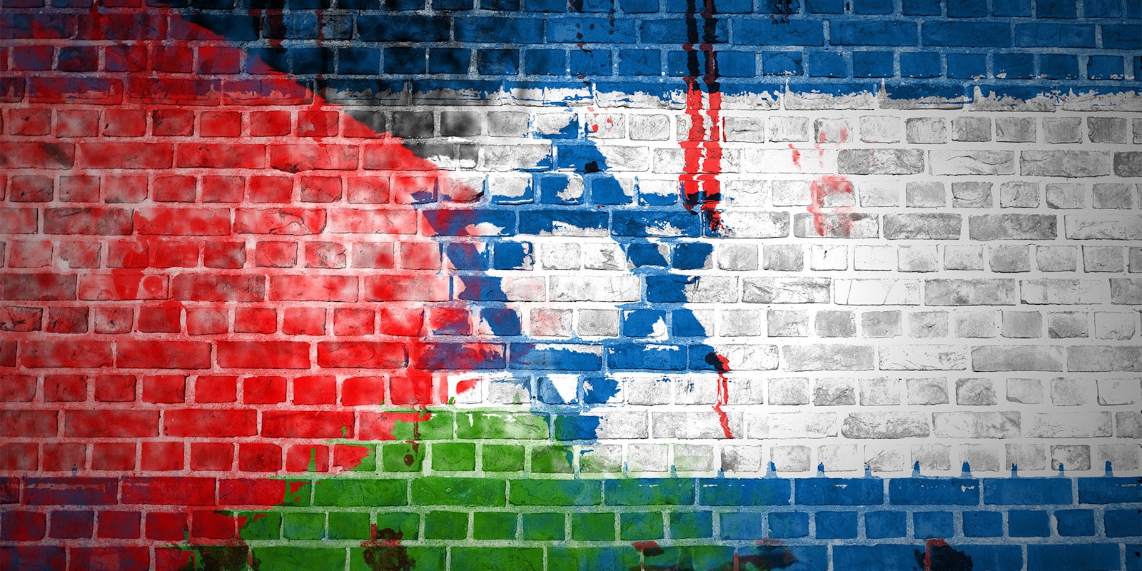 Palestinian and Israeli flags on brick wall