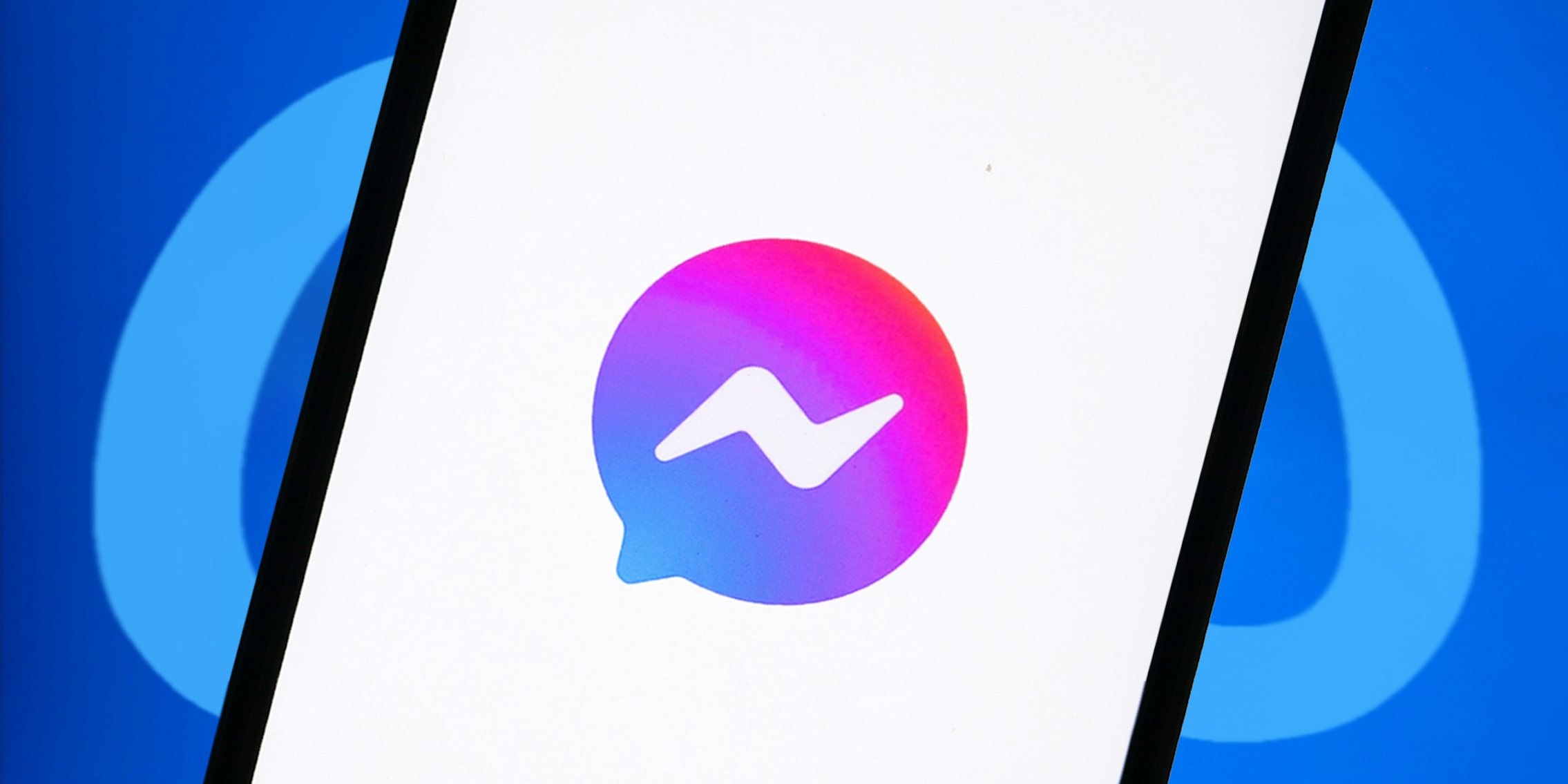 Facebook Messenger app opening on phone screen in front of blue Meta logo background
