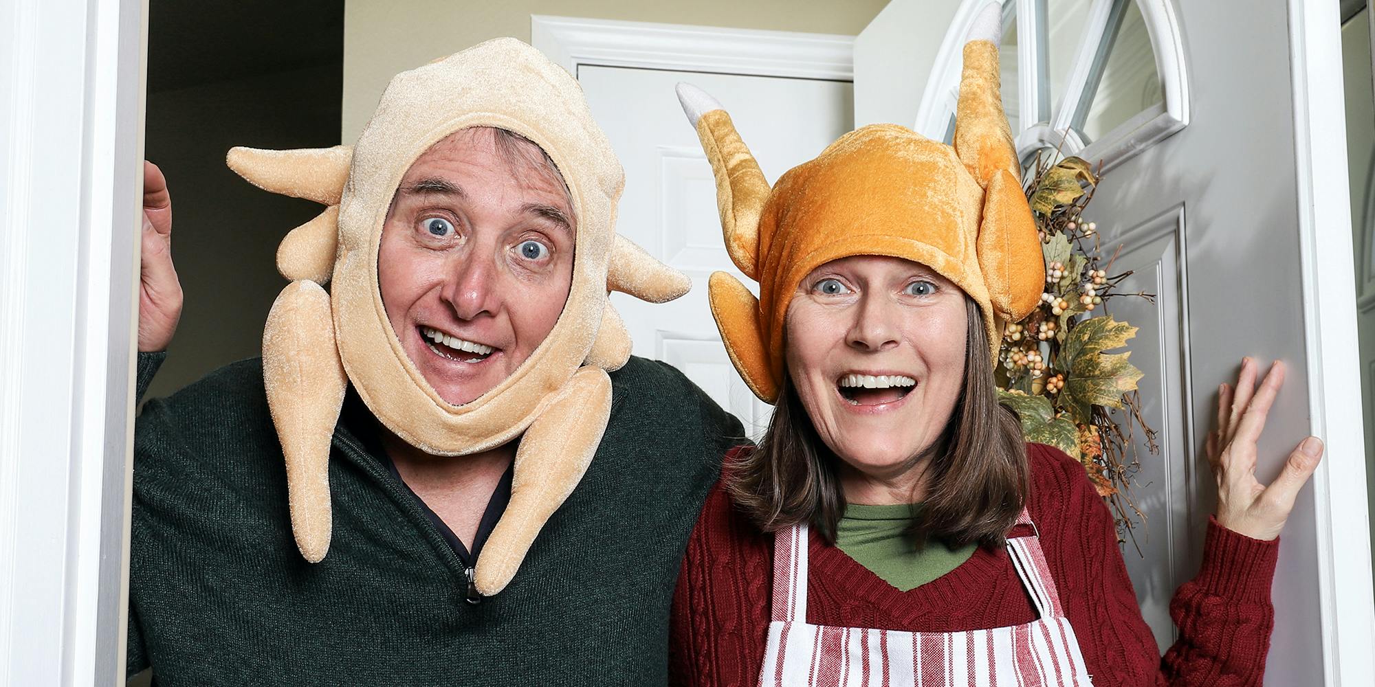 Couple wearing turkey hats