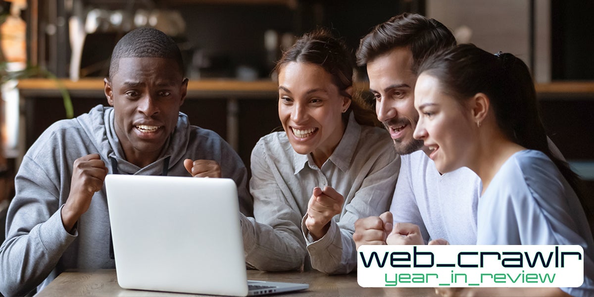 group of friends happy with laptop web_crawlr year_in_review logo at bottom right corner