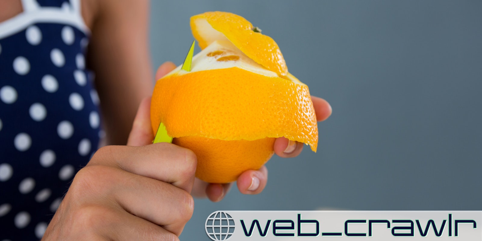 A person peeling an orange. The Daily Dot newsletter web_crawlr logo is in the bottom right corner.