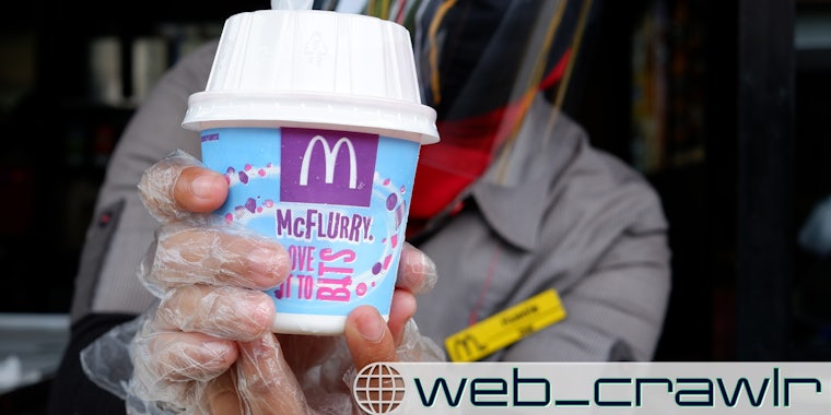 A McDonald's worker holding a McFlurry. The Daily Dot newsletter web_crawlr logo is in the bottom right corner.
