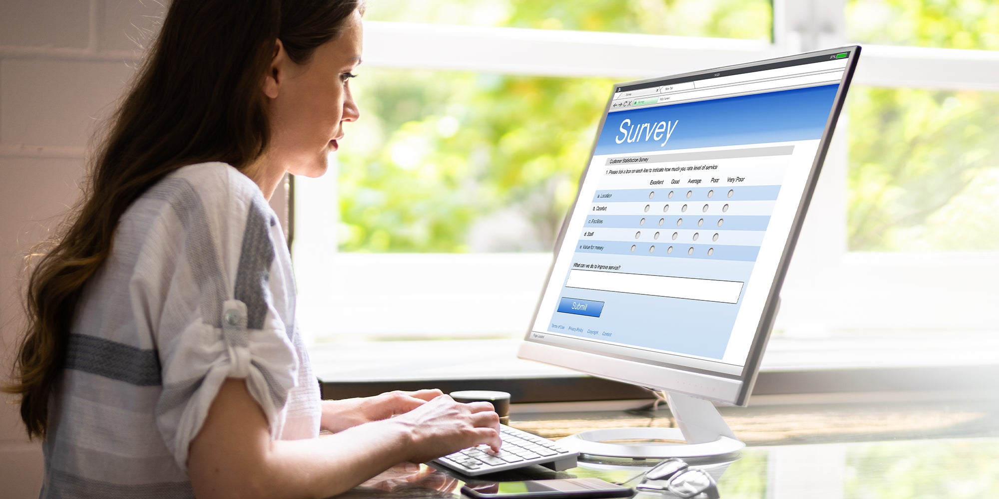 Close-up Of A Woman Filling Online Survey Form On Digital Tablet