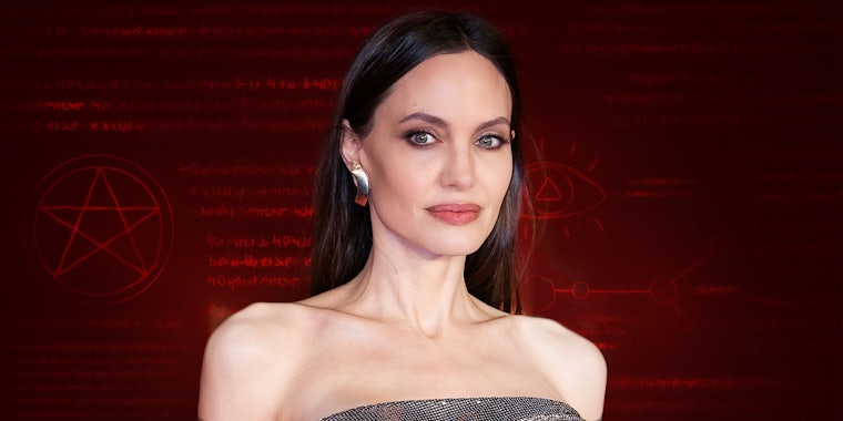 Angelina Jolie in front of red background