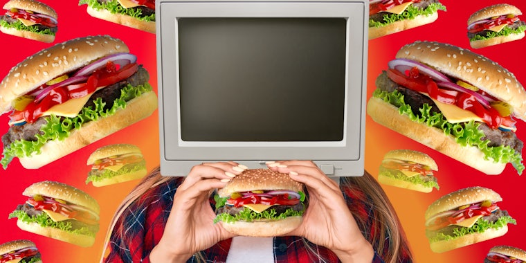 Computer eating a burger surrounded by burgers