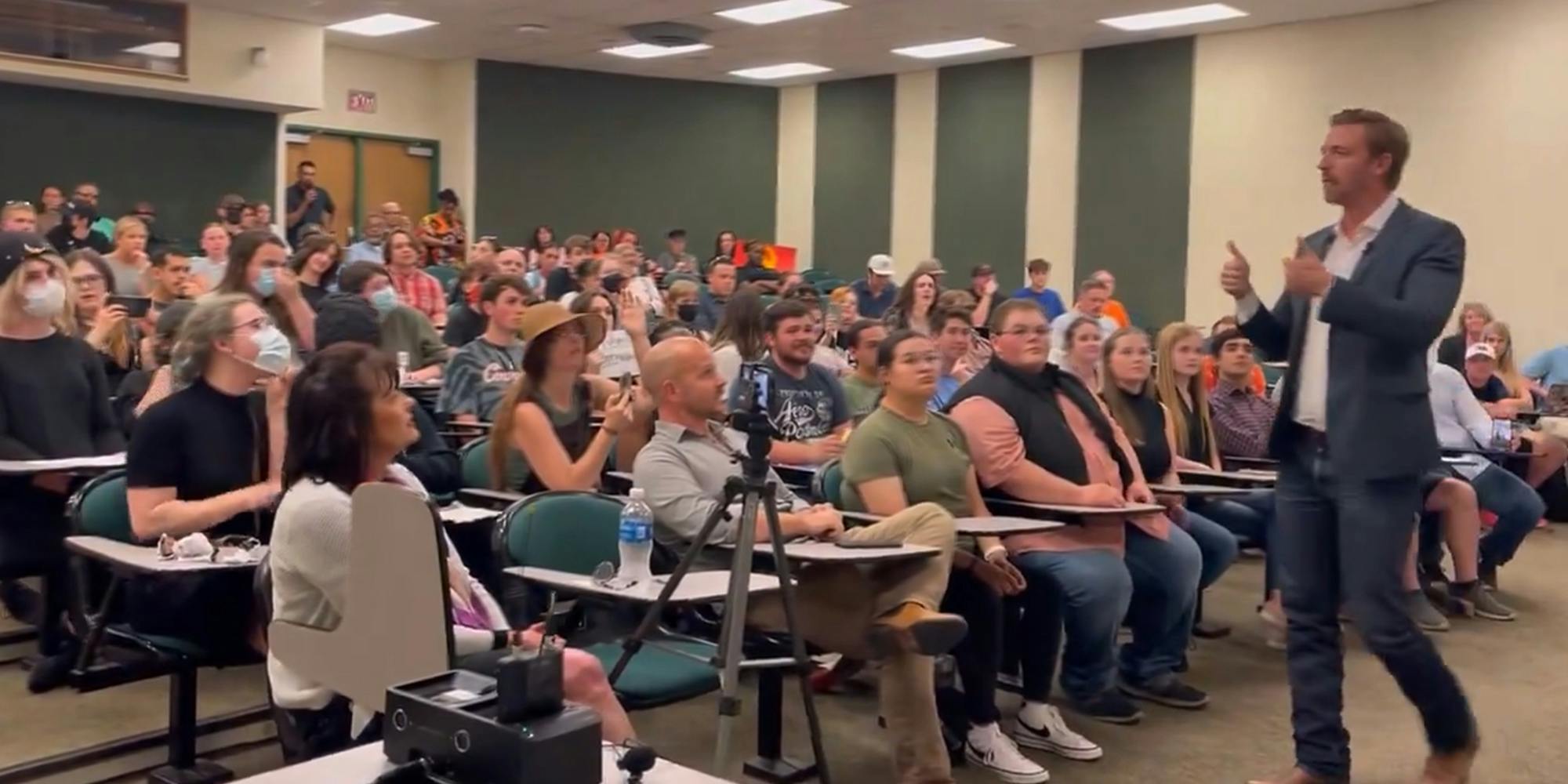 Oklahoma education official Ryan Walters ends speech amid protest after saying ‘never back down to a woke mob’