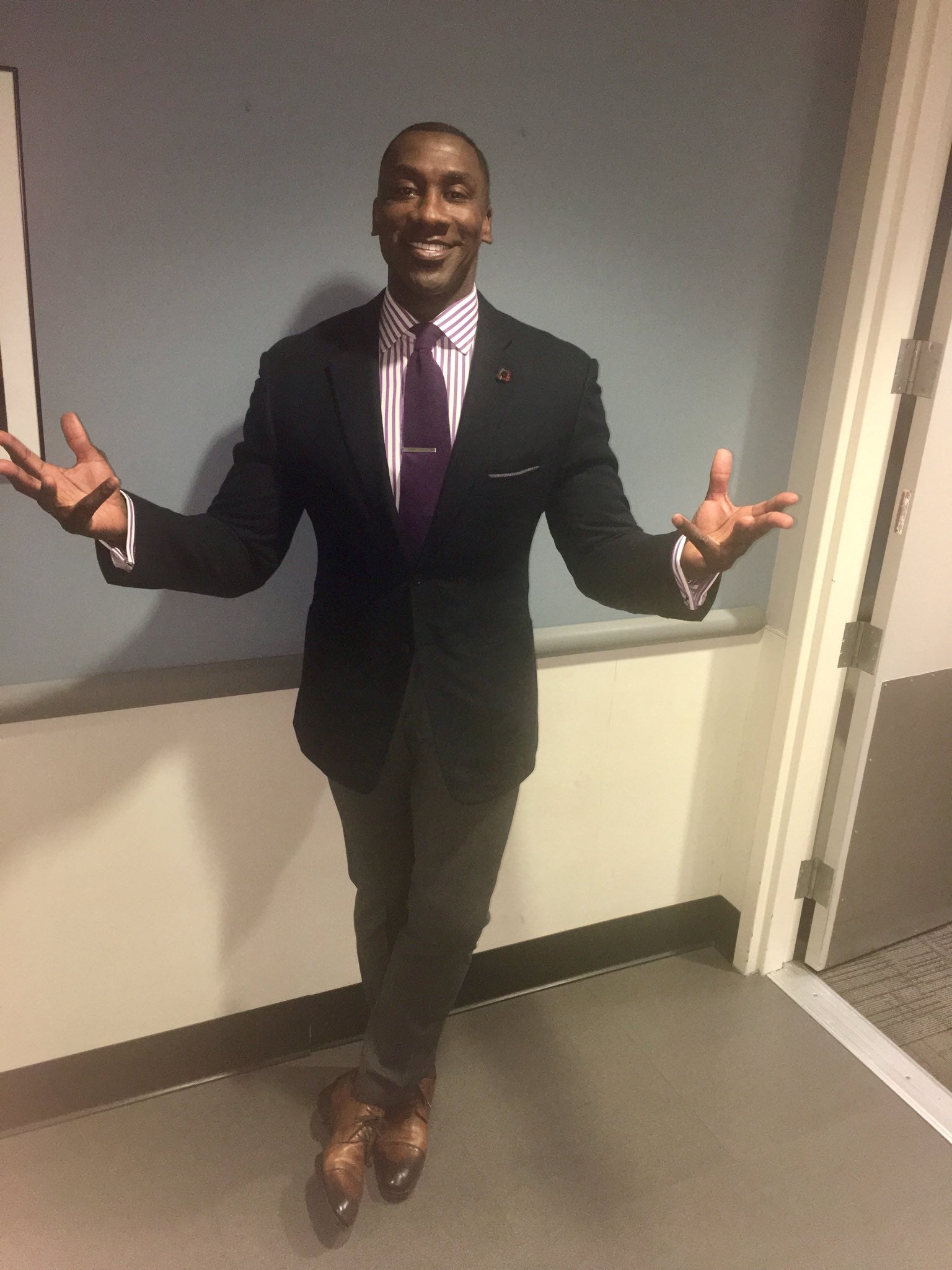 Shannon Sharpe meme: Sharpe posing in a suit