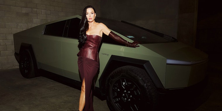 Katy Perry standing with Tesla truck