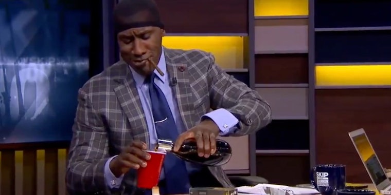 Shannon Sharpe meme - Sharpe pouring alcohol into a red solo cup