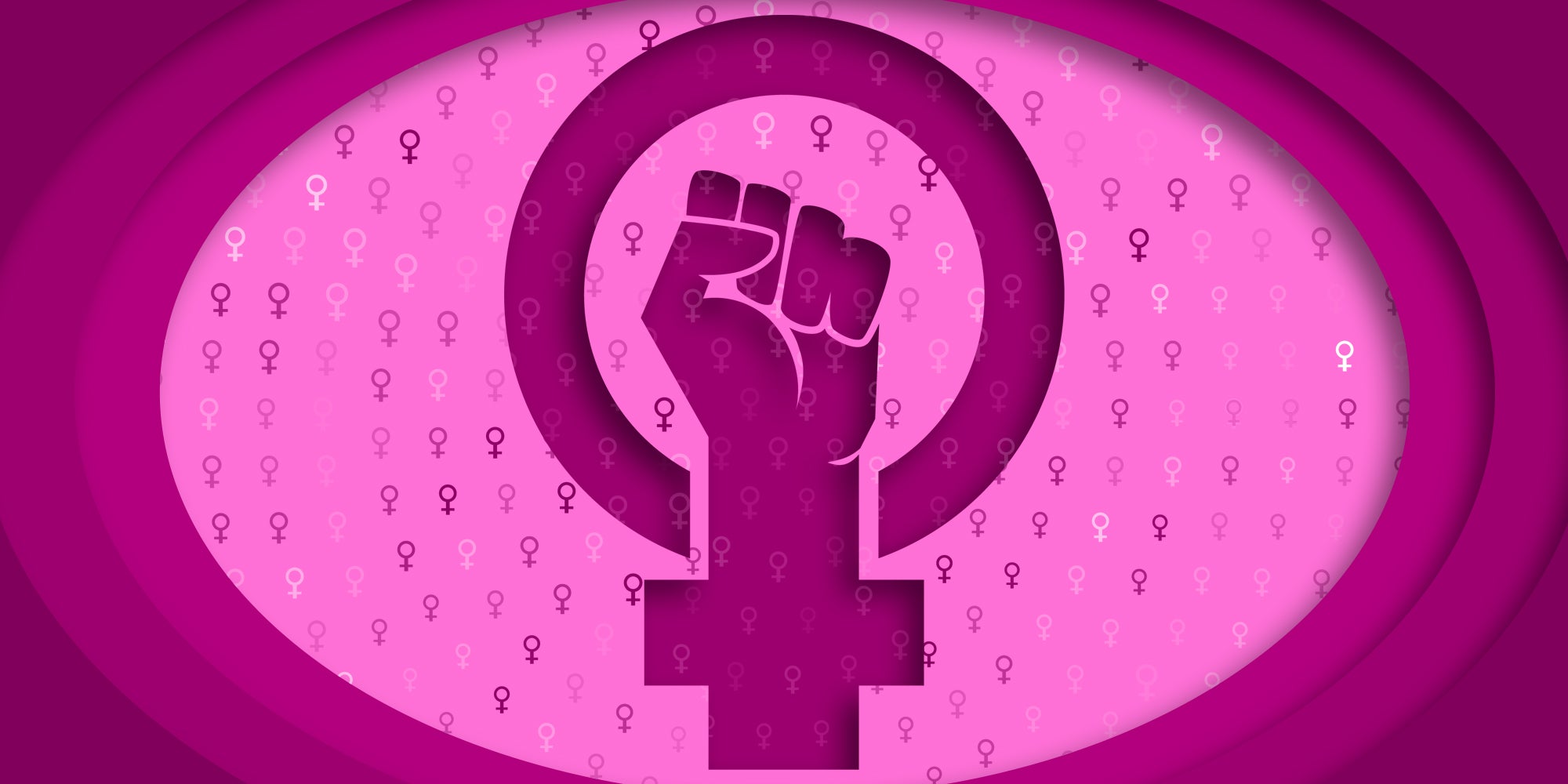 paper cutout of female symbol with power fist in the center