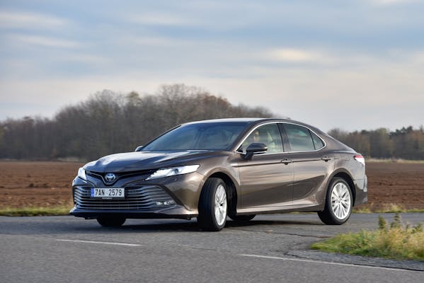 Toyota Camry - hybrid. Car while driving