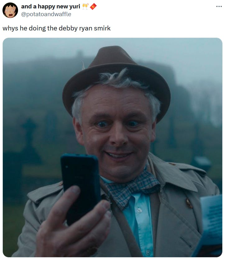Tweet with an image of Aziraphale from Good Omens accusing him of doing the Debby Ryan smirk.