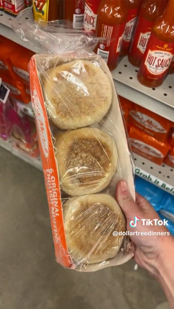 hand holding english muffins