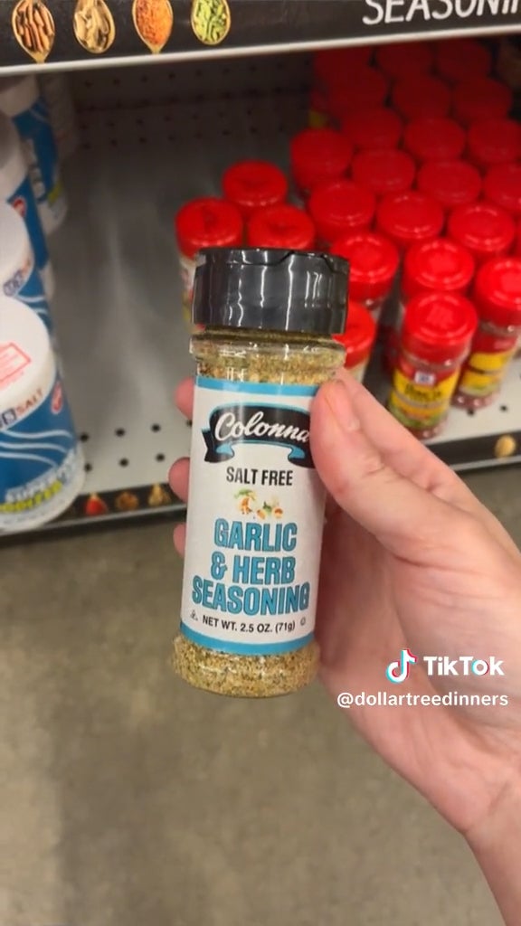 hand holding garlic herb seasoning