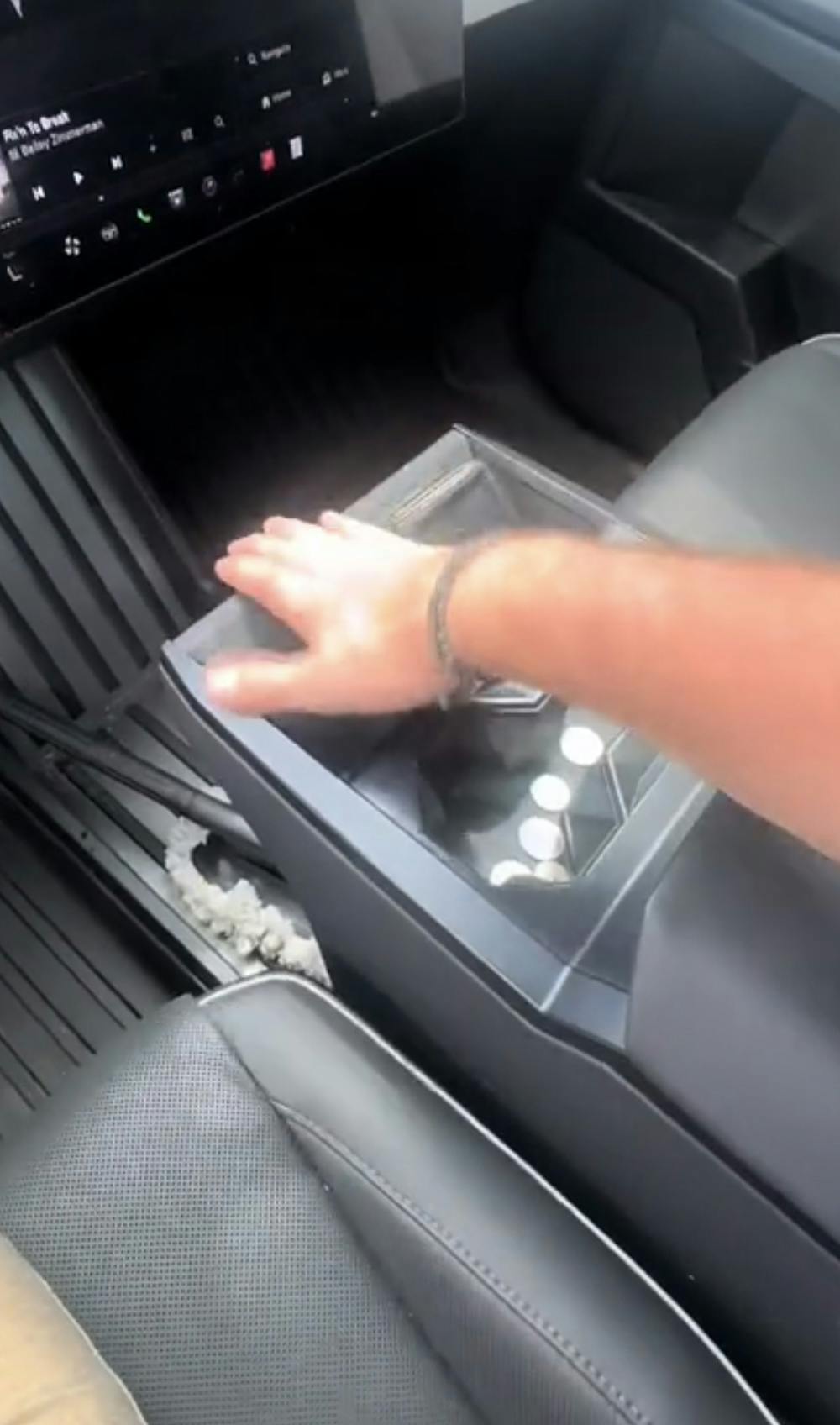 Hand showing car interior