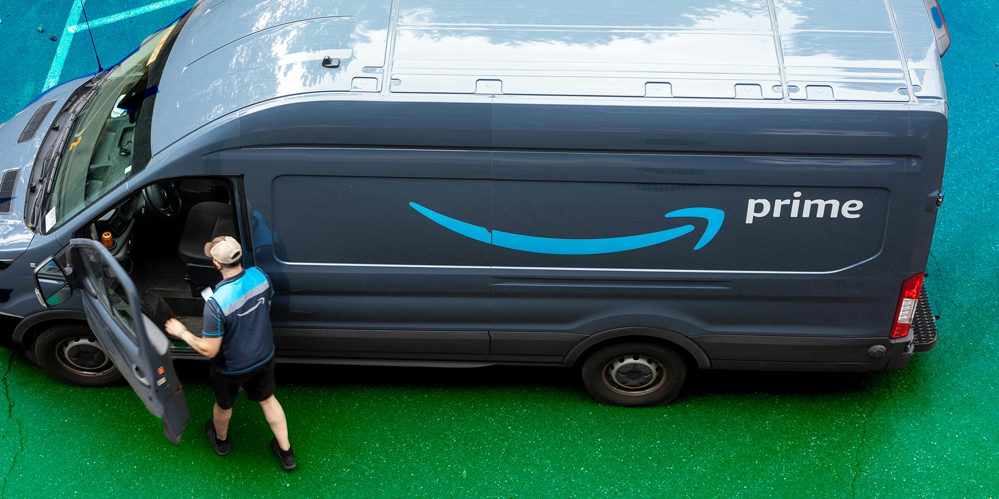 An Amazon delivery driver and his van are seen in a neighborhood parking lot in Lake Oswego, Oregon.