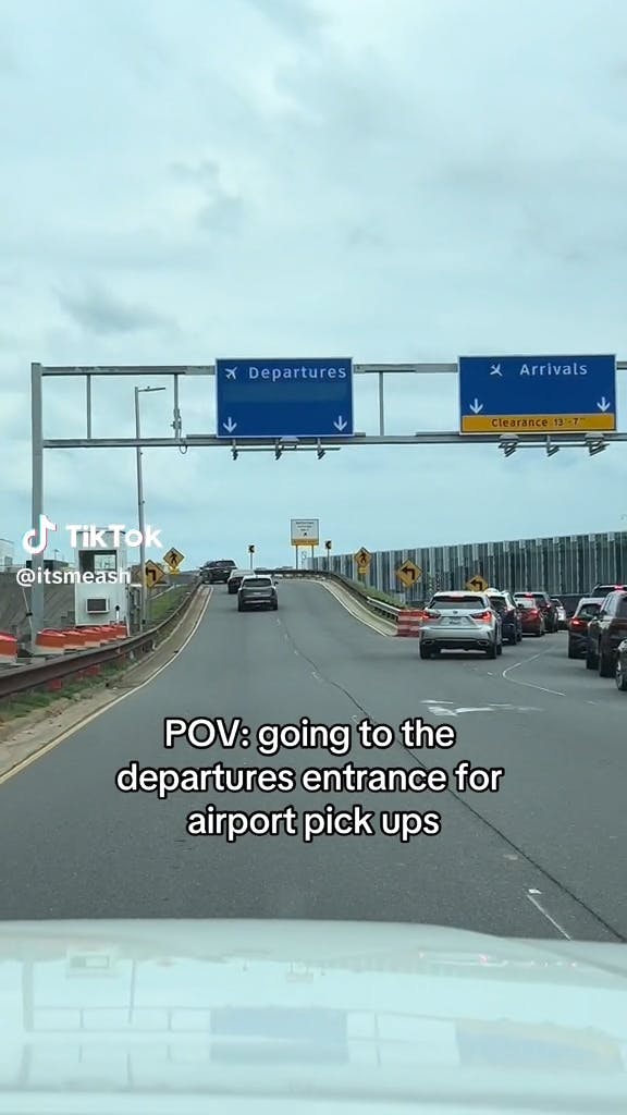 airport entrance with 'departures' and 'arrivals' lane, captioned 'POV: going to the departures entrance for airport pick ups'