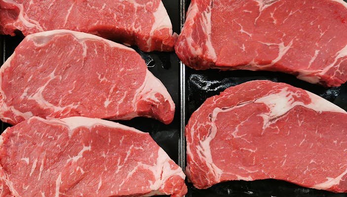 fresh raw beef rib eye steak for sale in grocery store