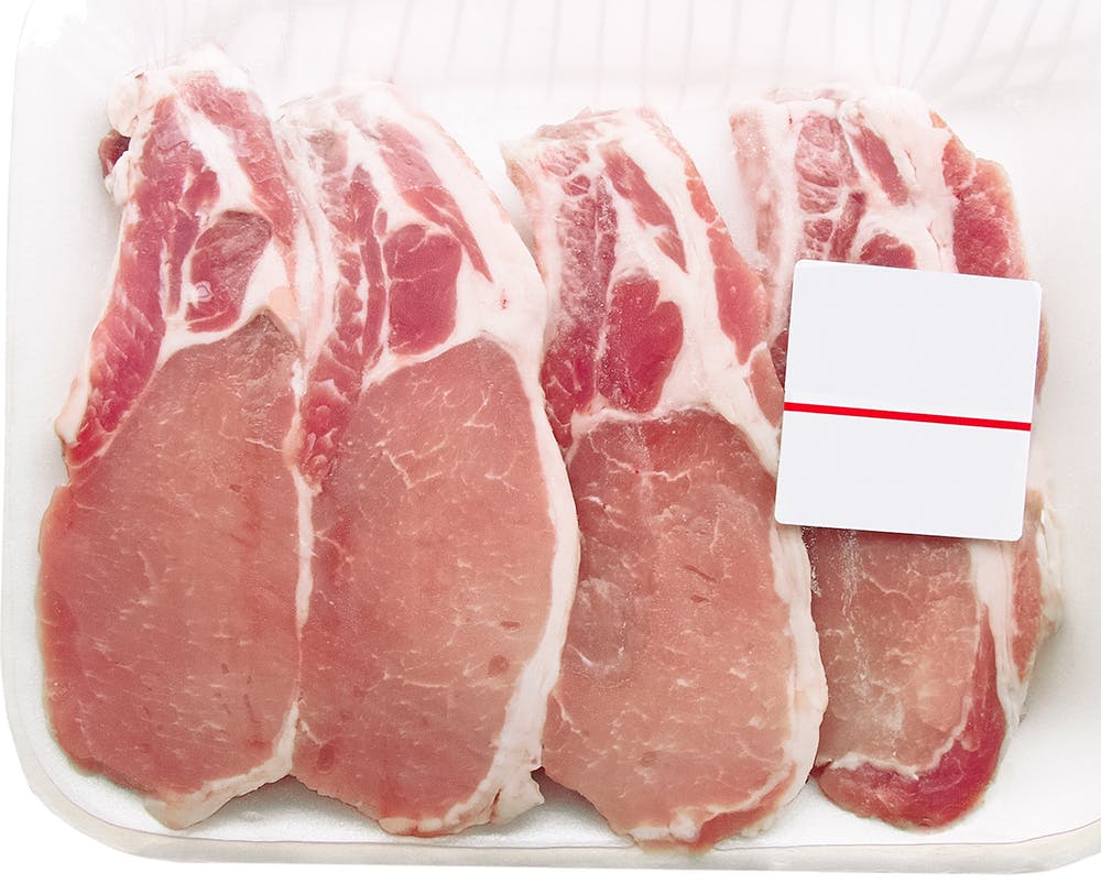 Pork chops packaged in a container with a price tag