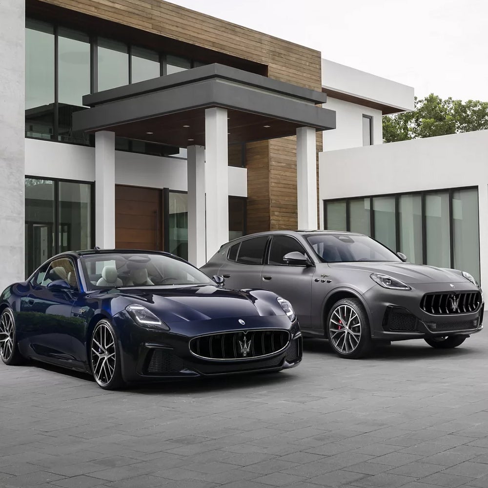 Two maserati cars in driveway