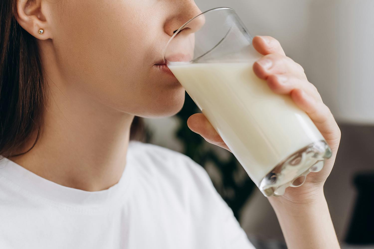 young woman drinking milk