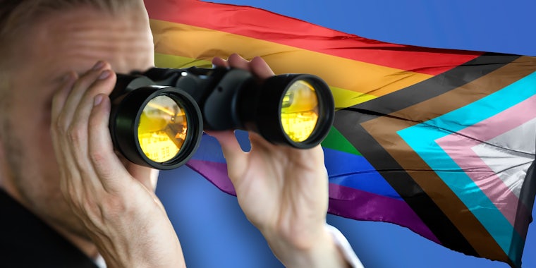 Man with binoculars staring at LGBTQIA flag