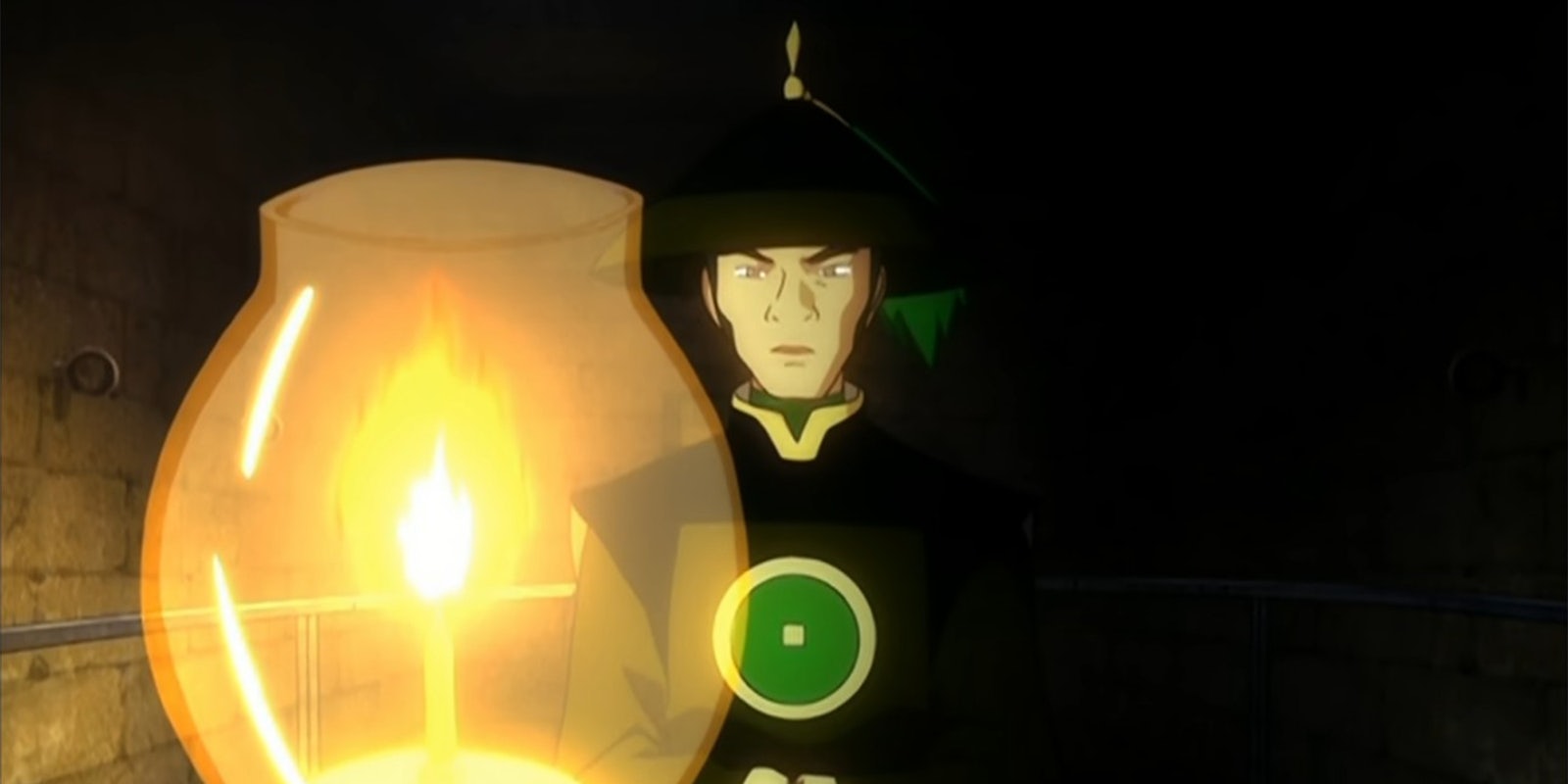 man standing behind a lantern