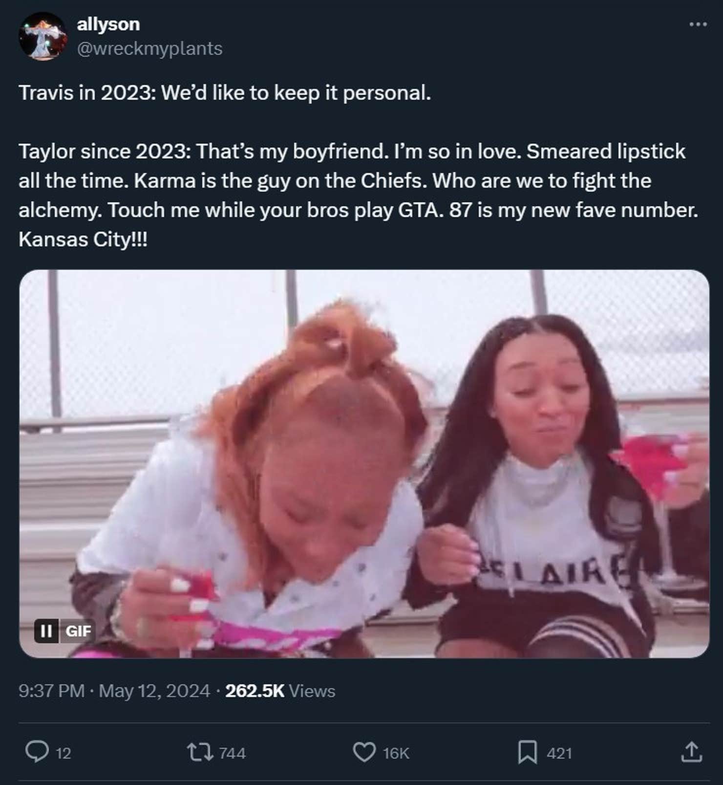 spit take gif in a tweet with the caption 'Travis in 2023: We’d like to keep it personal. Taylor since 2023: That’s my boyfriend. I’m so in love. Smeared lipstick all the time. Karma is the guy on the Chiefs. Who are we to fight the alchemy. Touch me while your bros play GTA. 87 is my new fave number. Kansas City!!!'