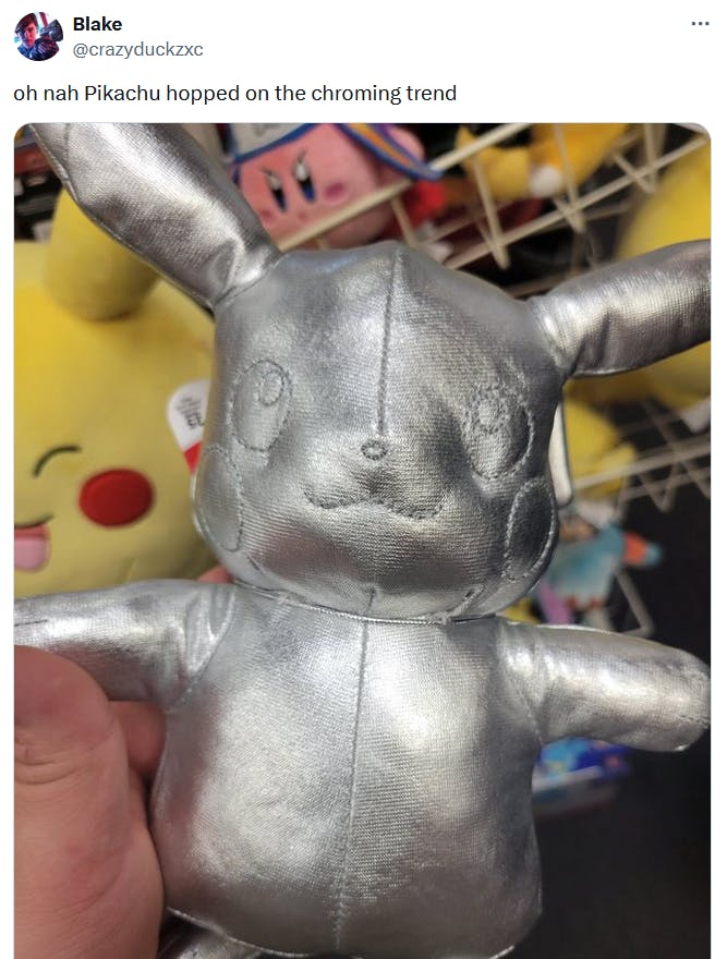Chroming meme with a silver Pikachu doll.