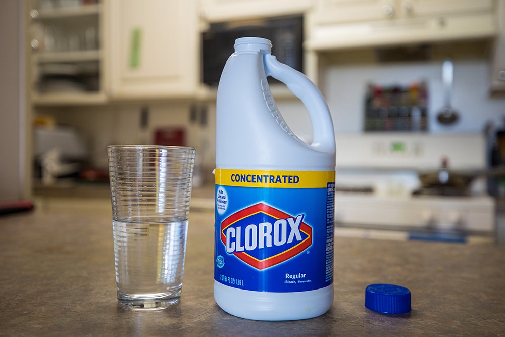 Bethesda, Maryland / USA - April 29, 2020: A person pours concentrated Clorox bleach into a glass. As with other bleach products, Clorox is a highly dangerous substance when ingested.